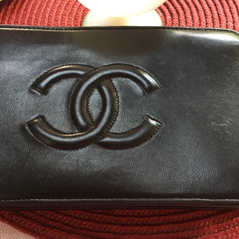 Chanel black leather wristlet   Gently used authentic Chanel red interior